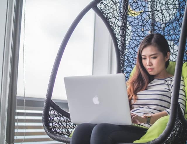 MacBook on woman's lap