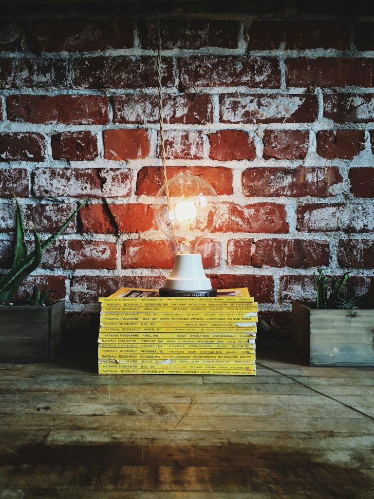 light bulb on pile of books